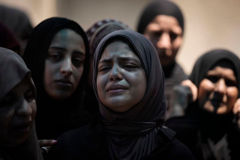 Mourners attend the funeral of Muhammad Sarhan,15, in the West Bank town of Tulkarem on Tuesday, July 2, 2024. Palestinian health officials say Sarhan and another woman were shot and killed, and four people were wounded by Israeli forces during a raid in the northern West Bank on Monday. (AP Photo/Majdi Mohammed)