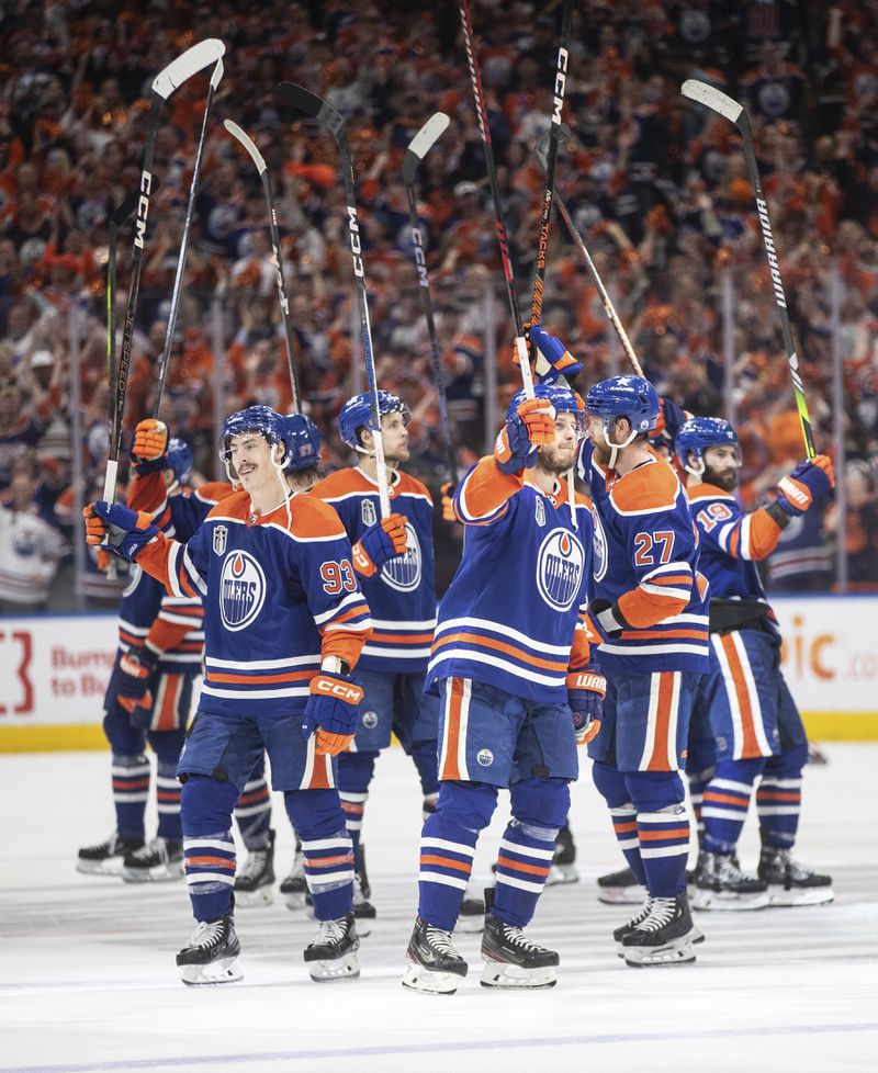Edmonton Oilers celebrate a win over the Florida Panthers in Game 6 of the NHL hockey Stanley Cup Final, Friday, June 21, 2024, in Edmonton, Alberta. The Oilers won 5-1 to tie the series. (Jason Franson/The Canadian Press via AP)