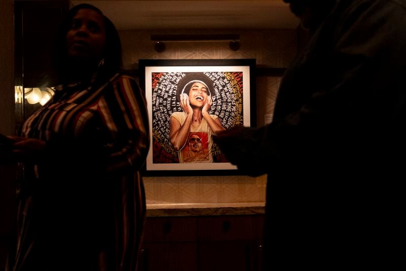 People mingle during Art Melanated’s Stevie Wonder exhibit opening at Thompson Atlanta in Buckhead on Friday, Feb. 2, 2024.   (Ben Gray / Ben@BenGray.com)