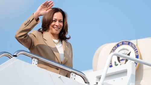 Vice President Kamala Harris waves while boarding Air Force Two as she departs Westfield-Barnes Regional Airport in Westfield, Mass., Saturday, July 27, 2024. Harris is returning to Washington after participating in a political event in Pittsfield, Mass. (AP Photo/Stephanie Scarbrough, Pool)