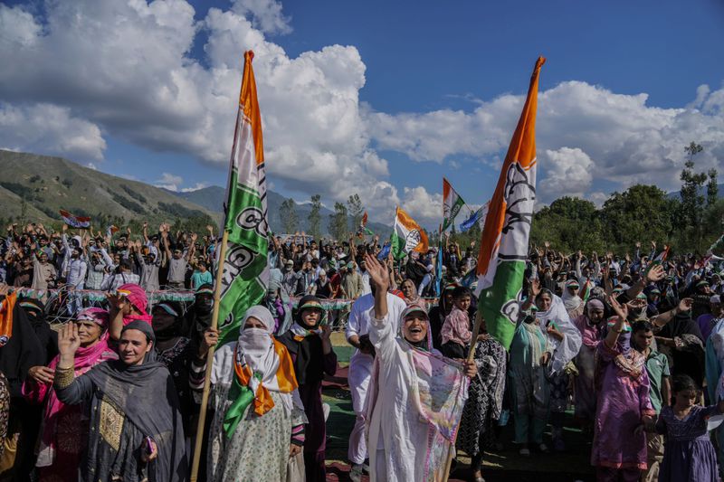 Supporters of India's opposition Congress party, wave during an election rally at Dooru some 78 kilometers (49 miles) south of Srinagar, Indian controlled Kashmir,Wednesday, Sept. 4, 2024. (AP Photo/Mukhtar Khan, File)