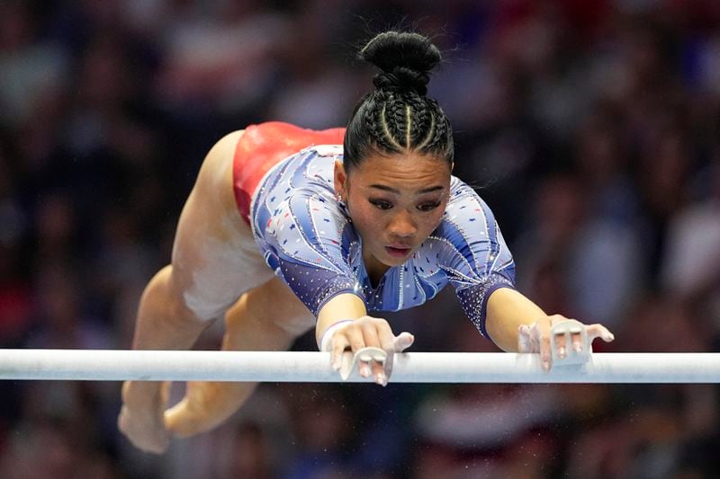 Suni Lee competes on the uneven bars at the United States Gymnastics Olympic Trials on Sunday, June 30, 2024, in Minneapolis. (AP Photo/Abbie Parr)