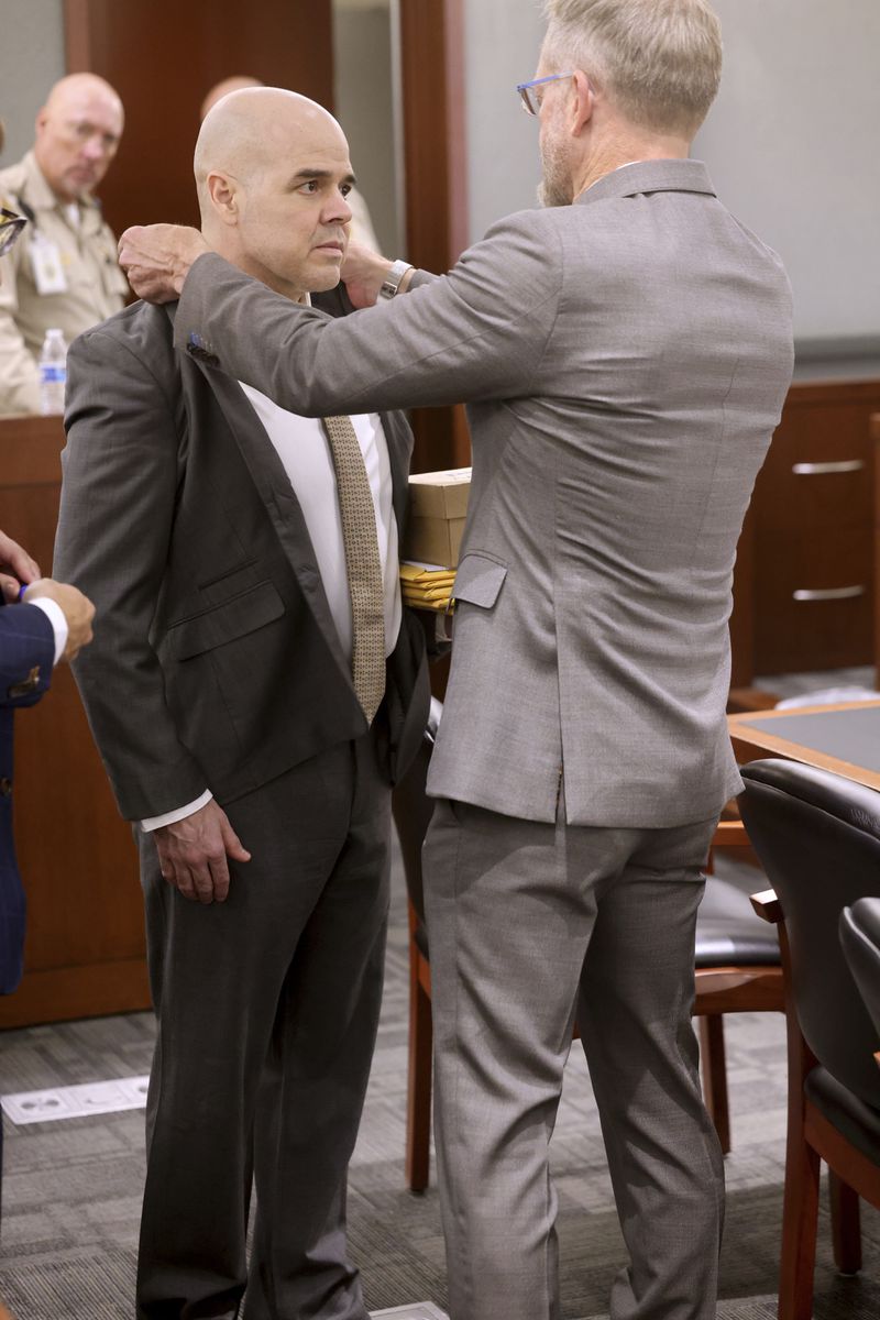 Defense attorney Robert Draskovich, right, adjusts the collar of his client Robert Telles prior to jury selection on the second day of Telles' murder trial at the Regional Justice Center in Las Vegas Tuesday, Aug. 13, 2024. Telles, a former Clark County public administrator, is charged in the murder of Las Vegas Review-Journal investigative journalist Jeff German. (K.M. Cannon/Las Vegas Review-Journal via AP, Pool)