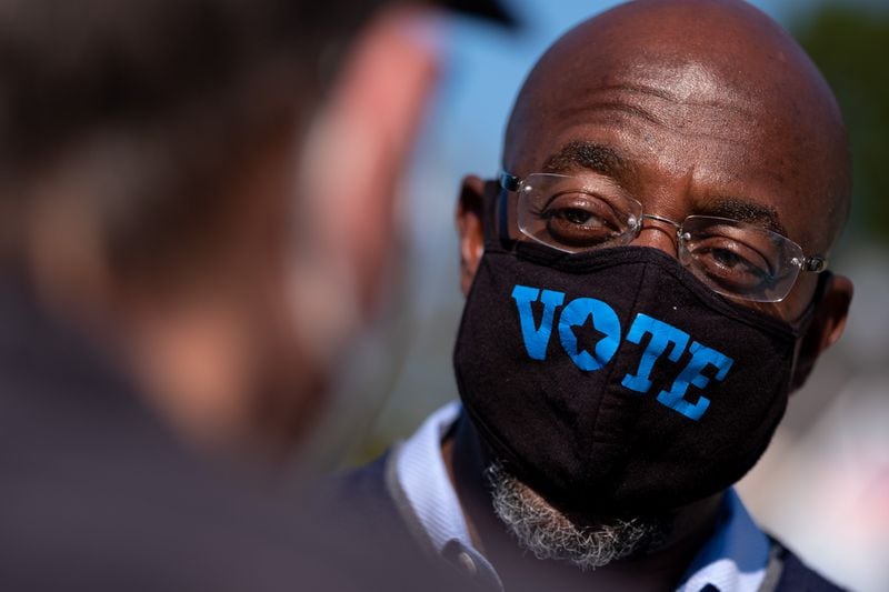 The coronavirus pandemic forced the Rev. Raphael Warnock to make changes both as a pastor and as a candidate for the U.S. Senate. Ben Gray for the Atlanta Journal-Constitution