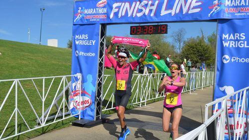 Two runners cross the finish line at the 2023 Combos Marathon & Half Marathon. The 2024 edition of the 18th annual race through Albany is set for March 2. (Photo Courtesy of Alan Mauldin)