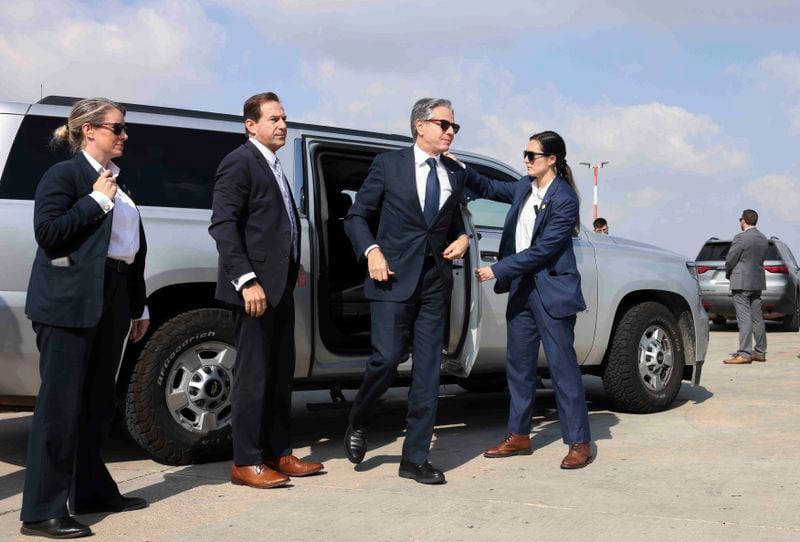 U.S. Secretary of State Antony Blinken steps out of a vehicle as he departs for Egypt, in Tel Aviv, Israel, Tuesday, Aug. 20, 2024. (Kevin Mohatt/Pool Photo via AP)