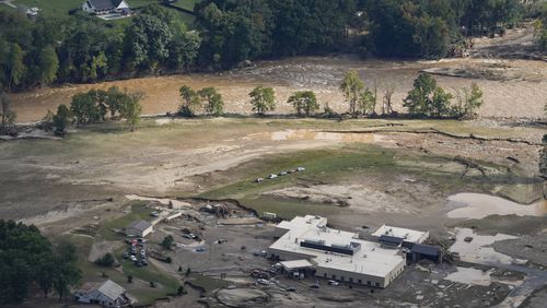 An aerial view of flood-damaged Unicoi County Hospital in the aftermath of Hurricane Helene, Saturday, Sept. 28, 2024, in Erwin, Tenn. (AP Photo/George Walker IV)