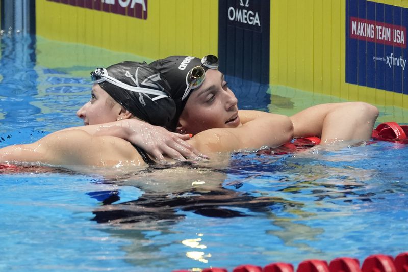 Kate Douglass and Alex Walsh celebrate after the Women's 200 individual medley finals Saturday, June 22, 2024, at the US Swimming Olympic Trials in Indianapolis. (AP Photo/Darron Cummings)