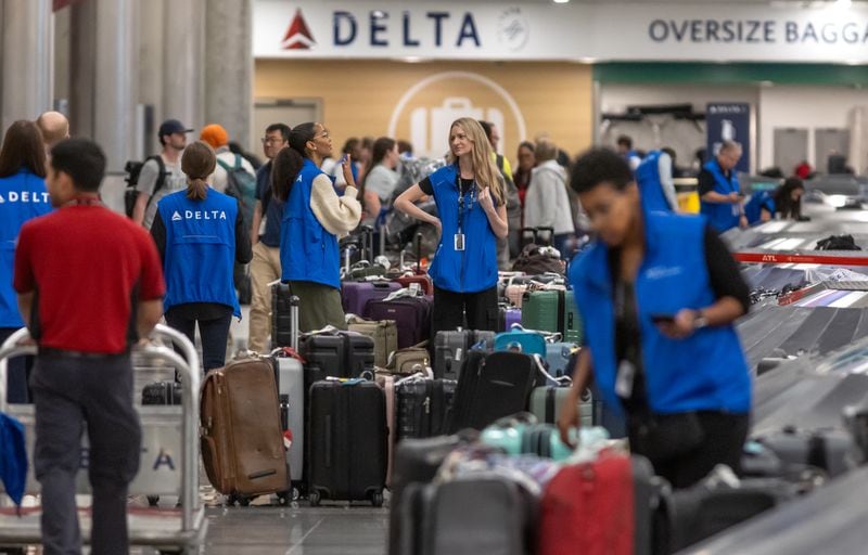 Delta Air Lines employees were busy Wednesday, July 24, 2024, at Hartsfield-Jackson International Airport and operations have started to recover from a meltdown that left hundreds of thousands of travelers stranded around the country over several days. The Delta disruption is drawing new scrutiny from federal lawmakers and the U.S. Department of Transportation. (John Spink/AJC)