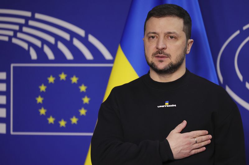 FILE- Ukraine's President Volodymyr Zelenskyy poses for a picture before an EU summit at the European Parliament in Brussels, Belgium, Thursday, Feb. 9, 2023. Ukraine is set to officially launch membership talks with the European Union on Tuesday, June 25, 2024, in what President Volodymyr Zelenskyy has described as a dream come true for his country's citizens more than two years into a war with Russia. (AP Photo/Olivier Matthys, File)