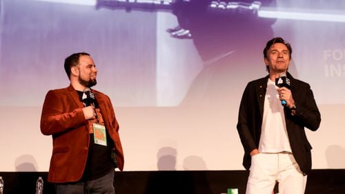 Ewan McGregor (right), shooting a film in Atlanta, came by for the 25th anniversary screening of "The Phantom Menace" at the Plaza Theatre Atlanta on May 4, 2024. He is here with owner Chris Escobar. JAMES ELLIS/ATLANTA FILM FESTIVAL