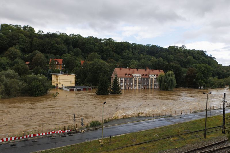 Garages and a house flooded in the town Kłodzko, in Poland's southwest, Sunday, Sept. 15, 2024, after days of unusually heavy rain. (AP Photo/Krzysztof Zatycki)