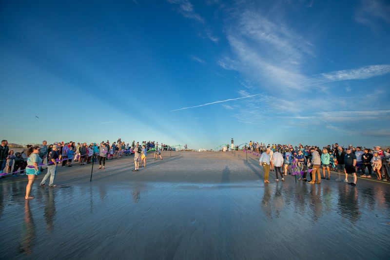 Hundreds of people lined north beach on Tybee Island Saturday to say goodbye to Ike as the loggerhead sea turtle returned to the ocean. (Casey Jones for the Savannah Morning News)