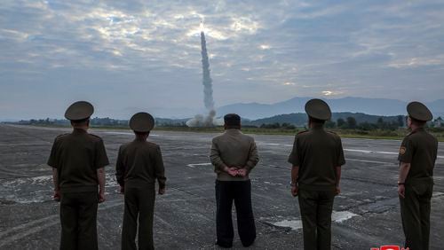 In this photo provided by the North Korean government, North Korean leader Kim Jong Un, center, oversees a launch of, what it says, the country’s newly built Hwasongpho-11-Da-4.5 ballistic missile at an undisclosed place in North Korea Wednesday, Sept. 18, 2024. Independent journalists were not given access to cover the event depicted in this image distributed by the North Korean government. The content of this image is as provided and cannot be independently verified. Korean language watermark on image as provided by source reads: "KCNA" which is the abbreviation for Korean Central News Agency. (Korean Central News Agency/Korea News Service via AP)