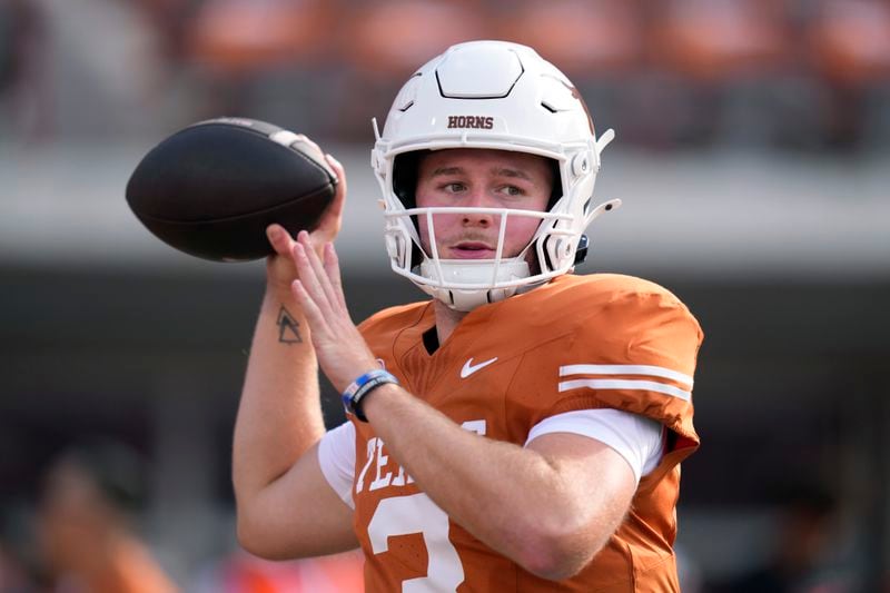 Texas quarterback Quinn Ewers (3) throws before an NCAA college football game against UTSA in Austin, Texas, Saturday, Sept. 14, 2024. (AP Photo/Eric Gay)