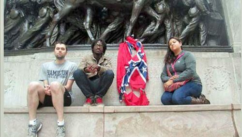 Stephen Allsop (second from left) says he and fellow protesters intended to make a statement by burning Confederate flags near a statue honoring black soldiers in the Union Army.