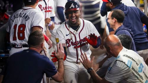 Atlanta Braves second baseman Ozzie Albies celebrates his go-ahead solo home run with teammates in the dugout during the eighth inning against the Detroit Tigers at Truist Park, Monday, June 17, 2024, in Atlanta. The Braves won 2-1. (Jason Getz / AJC)
