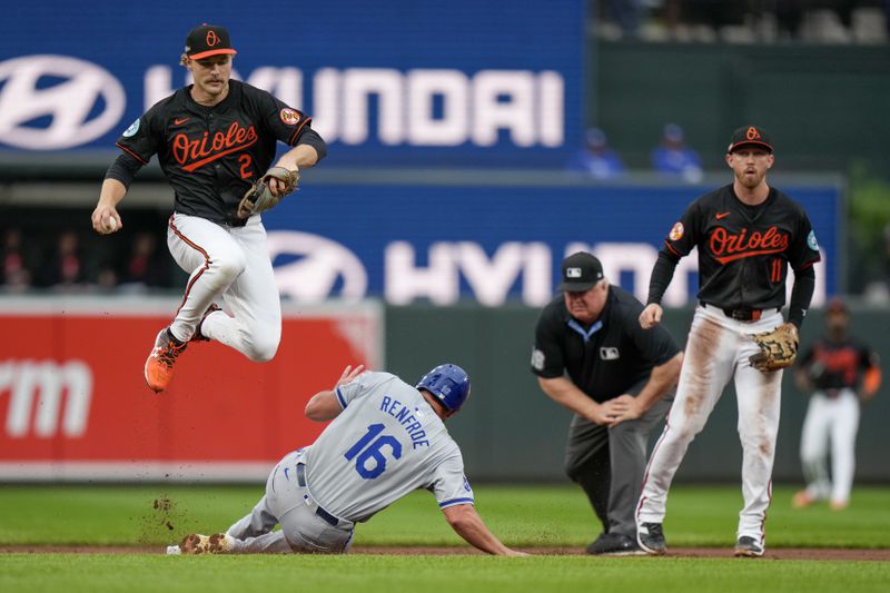 Baltimore Orioles shortstop Gunnar Henderson, top left, leaps to avoid the slide of Kansas City Royals' Hunter Renfroe (16) after forcing him out on a ground ball hit by Kyle Isbel during the second inning in Game 2 of an AL Wild Card Series baseball game, Wednesday, Oct. 2, 2024 in Baltimore. Second base umpire Bill Miller, second from right, and third base Jordan Westburg (11) look on. (AP Photo/Stephanie Scarbrough)