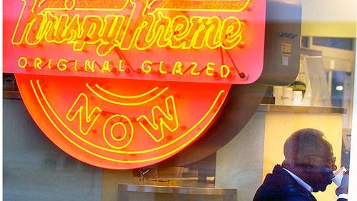 When Hank Aaron dived into the business world, he encountered plenty of skeptics. "I remember that and I said, 'If I have to crawl at night, I won't fail. I'm going to make all these people eat their words.' I'll do anything not to fail and that's why I kept pushing." Here, he's shown at a Krispy Kreme owned by his restaurant company. (Joey Ivansco / AJC 2004)