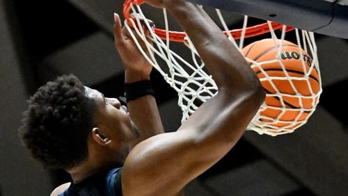 Wheeler's Arrinten Page (22) dunks the ball during 2023 GHSA Basketball Class 7A Boy’s State Championship game at the Macon Centreplex, Saturday, March 11, 2023, in Macon, GA. (Hyosub Shin / Hyosub.Shin@ajc.com)