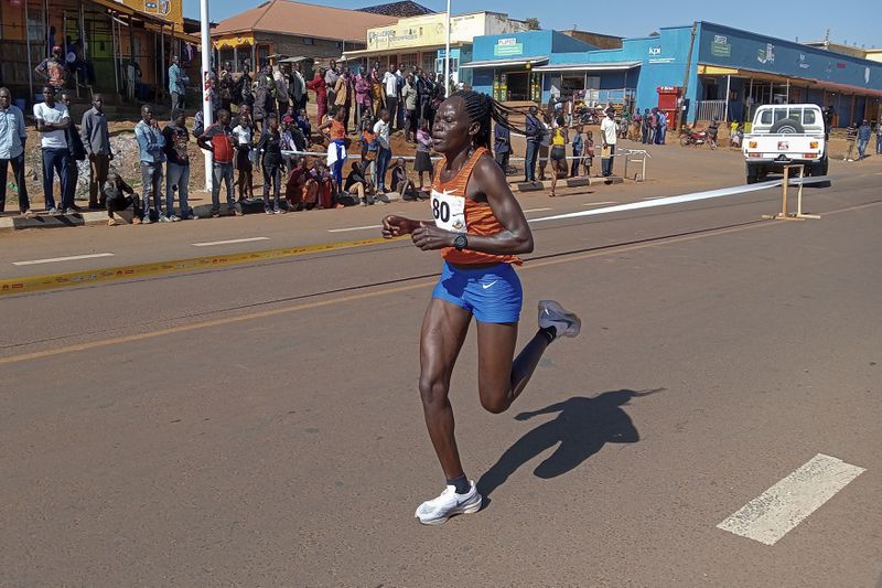 FILE -Rebecca Cheptegei, competes at the Discovery 10km road race in Kapchorwa, Uganda, Jan. 20, 2023. (AP Photo, File)