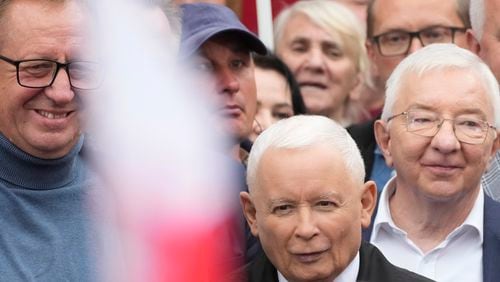 Leader of Poland's right-wing opposition party Law and Justice, Jaroslaw Kaczynski, front, attends the party's protest rally of a few thousand backers against the policies of Prime Minister Donald Tusk's Cabinet before the Ministry of Justice, in Warsaw, Poland, Saturday Sept. 14, 2024. (AP Photo/Czarek Sokolowski)