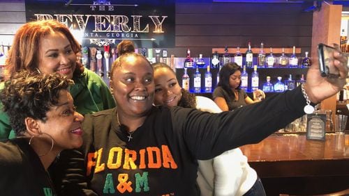 Gabby Albert, Tamara Crockett, Amber Spencer and Talibah McIntyre-Handy share a selfie during a FAMU brunch before the Honda Battle of the Bands, put on by their group, The Litty Committee. (Marlon A. Walker/AJC)