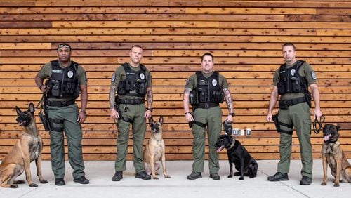 Photo from the autumn of 2017 depicts the Woodstock police K9 unit when it was recertified and recognized at the South Georgia K-9 Training and Certification Workshop in Perry: Officer Nik Petit-Alleyne and K9 Rex (from left), Officer Jarred Jackson and K9 Exo, Officer Mathew Dunn and K9 Rosa, and Officer Daniel Butler and K9 Dugan. CITY OF WOODSTOCK