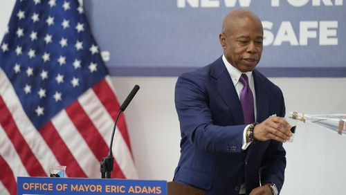 NYC Mayor Eric Adams gets a refill of NYC tap water while speaking to reporters at a news conference about repairs occurring to the water supply infrastructure in New York, Monday, Sept. 30, 2024. (AP Photo/Seth Wenig)