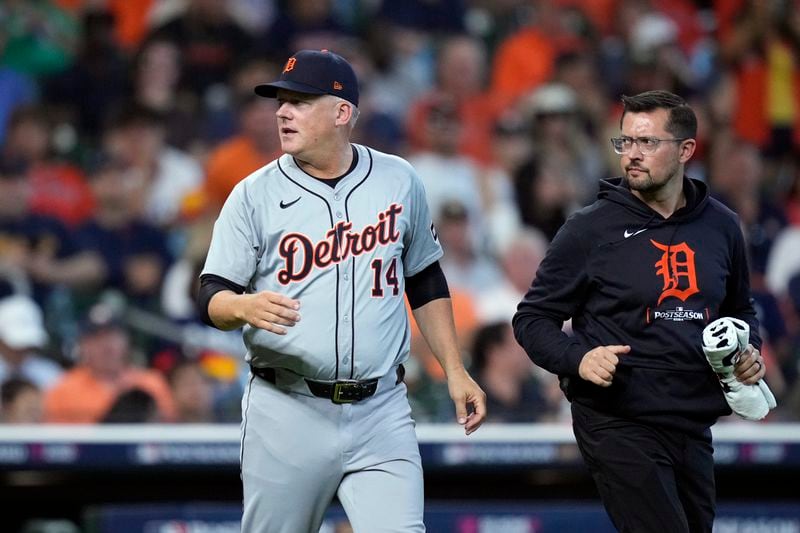 Detroit Tigers manager A.J. Hinch checks on starting pitcher Tarik Skubal during the sixth inning of Game 1 of an AL Wild Card Series baseball game against the Houston Astros, Tuesday, Oct. 1, 2024, in Houston. (AP Photo/Kevin M. Cox)