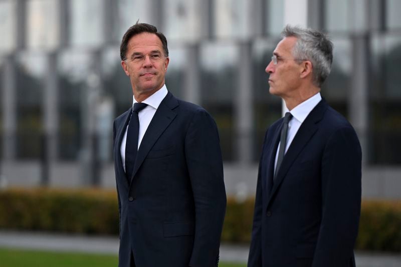 The incoming NATO Secretary General Mark Rutte, left, and NATO Secretary General Jens Stoltenberg stand during a wreath laying ceremony at NATO headquarters in Brussels, Belgium, Tuesday, Oct. 1, 2024. (AP Photo/Harry Nakos)