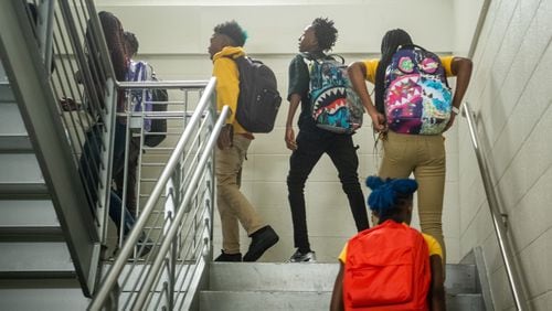 Students switch classes at the Sylvan Hills Middle School’s first day of class in Atlanta on Thursday, Aug. 1, 2024. The school district spent $285,000 on new software to address chronic absenteeism. Educators say students who miss too many days of school often underperform academically. (Ziyu Julian Zhu / AJC)