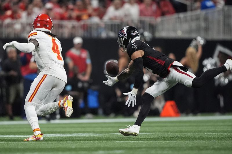 Atlanta Falcons safety Jessie Bates III (3) breaks up a pass intended for Kansas City Chiefs wide receiver Rashee Rice (4) during the first half of an NFL football game, Sunday, Sept. 22, 2024, in Atlanta. (AP Photo/Brynn Anderson)