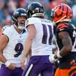 Baltimore Ravens kicker Justin Tucker, left, reacts with holder Jordan Stout after booting the game-winning field goal in overtime of an NFL football game, Sunday, Oct. 6, 2024, in Cincinnati. The Ravens won 41-38 in overtime. (AP Photo/Carolyn Kaster)