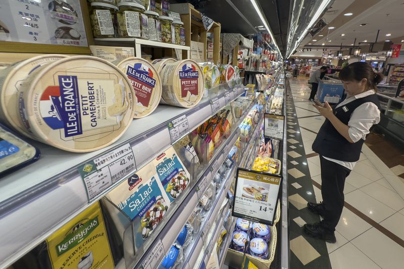 Imported cheese from Europe are displayed at a supermarket in Beijing, Wednesday, Aug. 21, 2024. (AP Photo/Ng Han Guan)