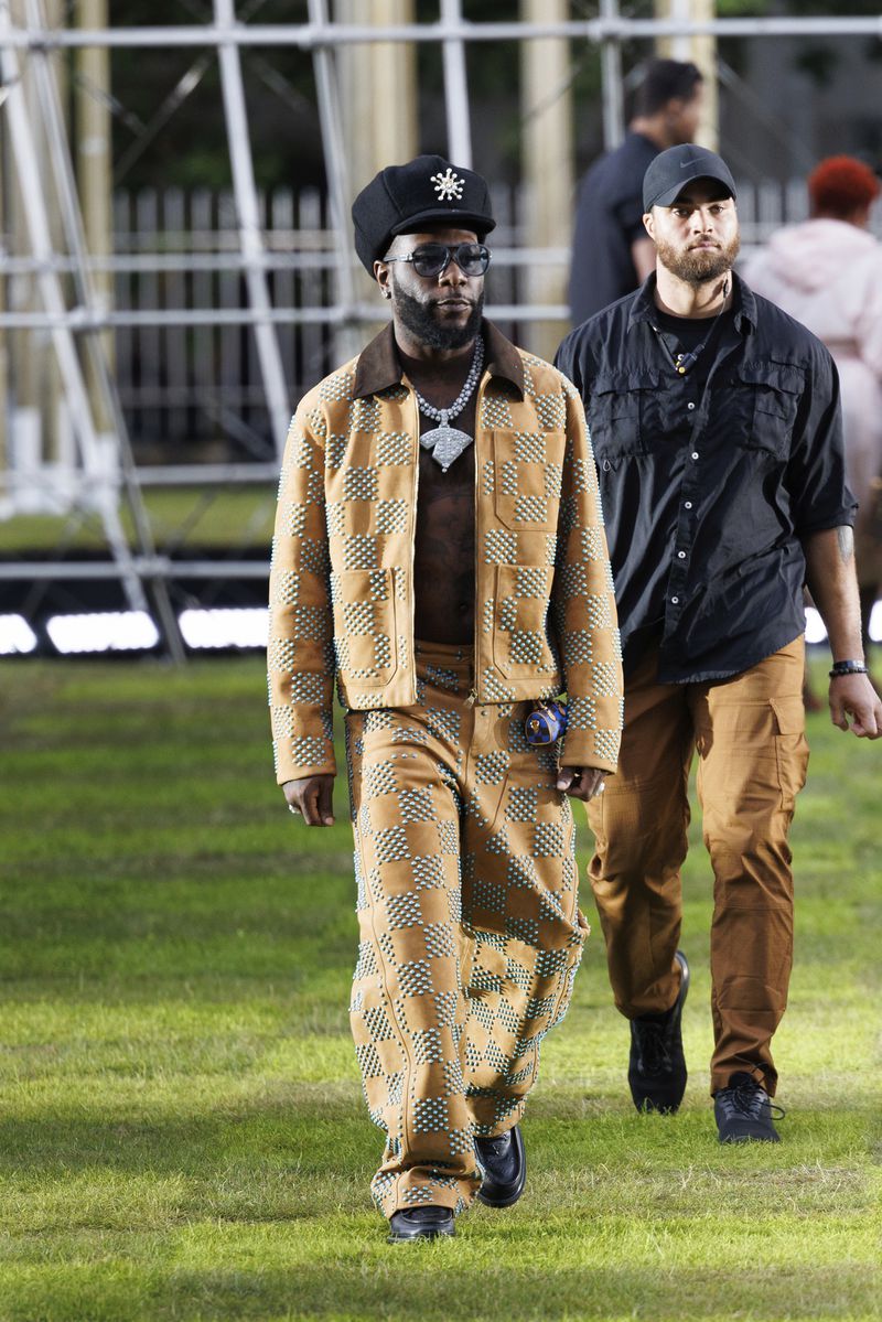 Burna Boy arrives for the Louis Vuitton Spring Summer 2025 collection, that was presented in Paris, France, Monday, June 18, 2024. (Photo by Vianney Le Caer/Invision/AP)