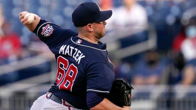 Atlanta Braves relief pitcher Luke Jackson winds up against the