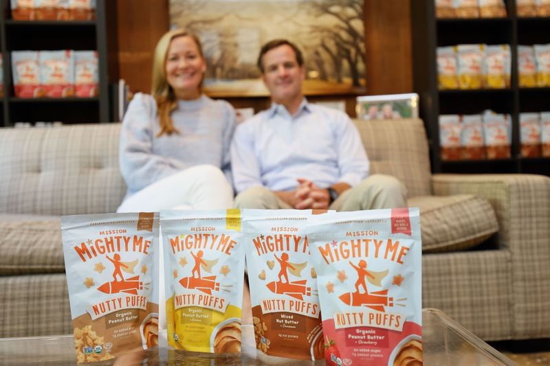 Founders of the nut butter puffs Mission MightyMe, Catherine and J.J. Jaxon, pose in their house with their products on display as they celebrate a recent deal with Target. Wednesday, August 28, 2024.
(Miguel Martinez / AJC)