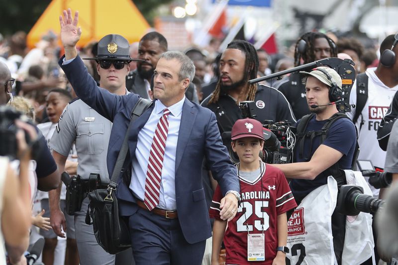 South Carolina head coach Shane Beamer waves to fans during the Gamecock Walk before an NCAA college football game against LSU, Saturday, Sept. 14, 2024 in Columbia, S.C. (AP Photo/Artie Walker Jr.)