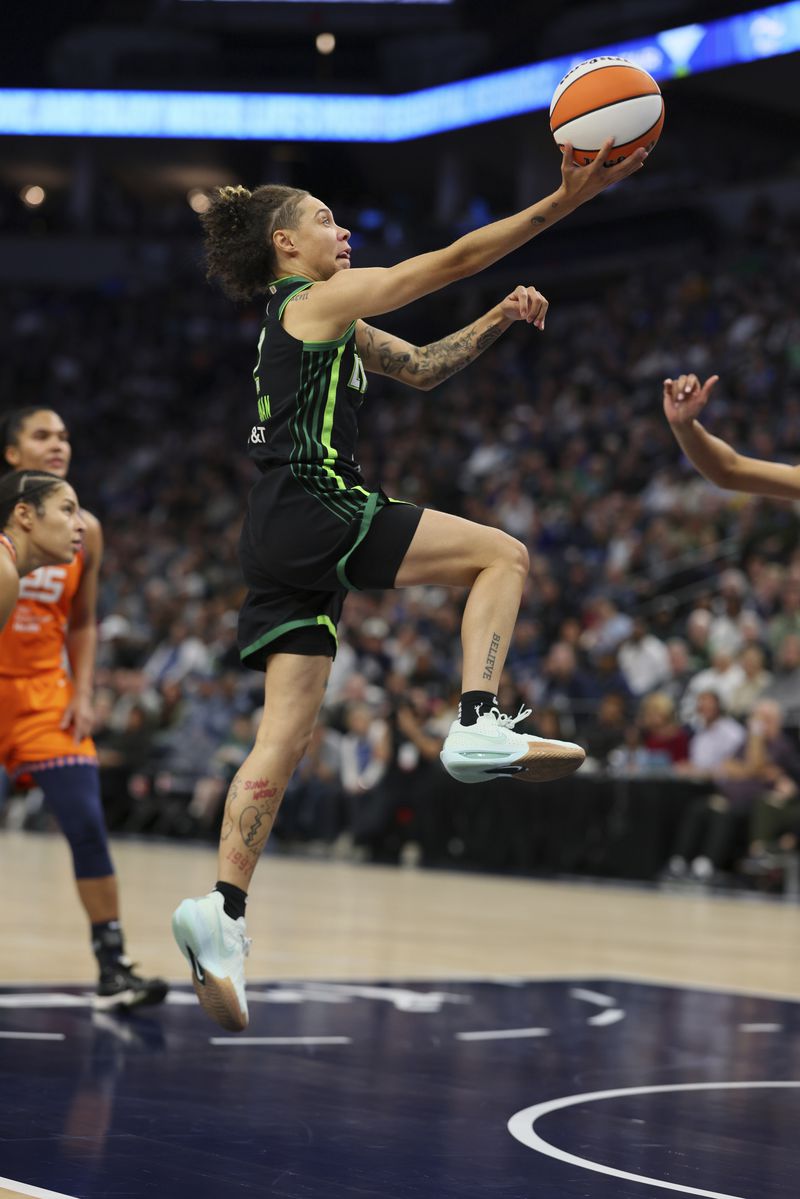 Minnesota Lynx guard Natisha Hiedeman (2) shoots the ball during the second half of Game 2 of a WNBA basketball semifinals game against the Connecticut Sun, Tuesday, Oct. 1, 2024, in Minneapolis. (AP Photo/Adam Bettcher)