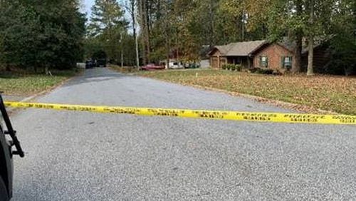 Police said the man was killed after shooting at officers following a six-hour standoff at a home near Lilburn.