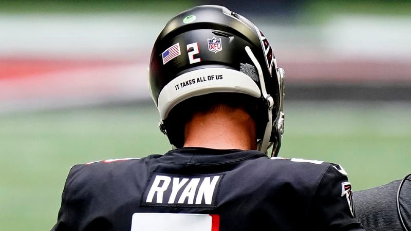 Atlanta Falcons quarterback Matt Ryan (2) stands on the sidelines during the first half against the Seattle Seahawks, Sunday, Sept. 13, 2020, in Atlanta. Ryan was among 38 Atlanta players to have the name of a victim of social injustice or a phrase on the bottom of their helmet. (AP Photo/Brynn Anderson)