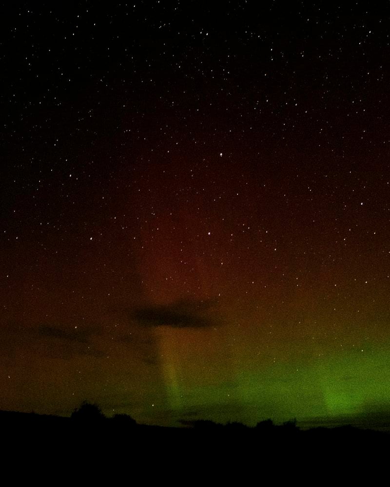 An aurora borealis, also known as the northern lights, is seen in the starry night sky on Tuesday, Sept. 24, 2024, near Washtucna, Wash. (AP Photo/Ted S. Warren)