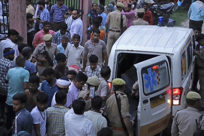An injured arrives in an ambulance at the Sikandrarao hospital in Hathras district about 350 kilometers (217 miles) southwest of Lucknow, India, Tuesday, July 2, 2024. At least 60 people are dead and scores are injured after a stampede at a religious gathering of thousands of people in northern India, officials said Tuesday.(AP Photo/Manoj Aligadi)