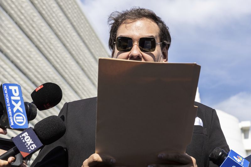 Former U.S. Rep George Santos speaks to the media outside the federal courthouse in Central Islip, N.Y. on, Monday, Aug. 19, 2024 in New York. (AP Photo/Stefan Jeremiah)