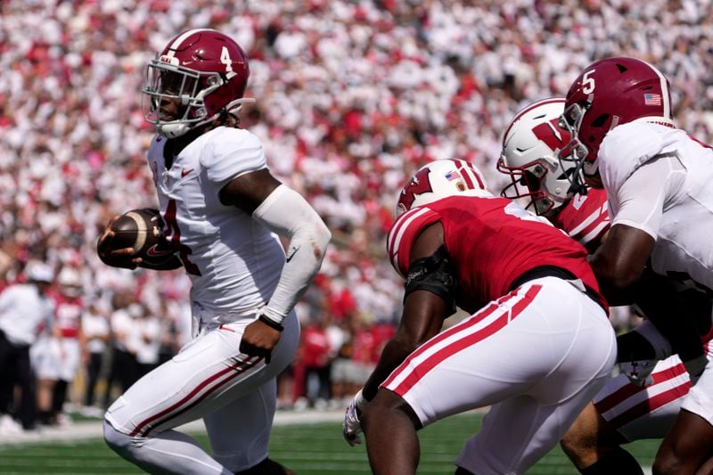 Alabama's Jalen Milroe (4) runs for a touchdown during the first half of an NCAA college football game against Wisconsin Saturday, Sept. 14, 2024, in Madison, Wis. (AP Photo/Morry Gash)