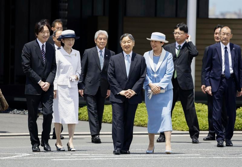 Japanese Emperor Naruhito, center left, and Empress Masako, center right, smile as they depart for the state visit to Britain, at Haneda airport in Tokyo, Japan, Saturday, June 22, 2024. Japanese Crown Prince Akishino is seen at left, while Crown Princess Kiko is at second left. (Kyodo News via AP)