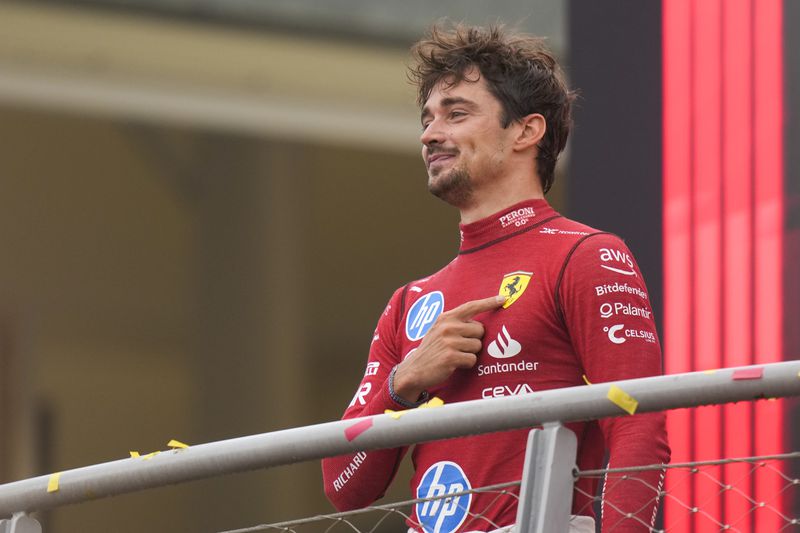 Ferrari driver Charles Leclerc of Monaco celebrates on the podium after the Formula One Italian Grand Prix race at the Monza racetrack, in Monza, Italy, Sunday, Sept. 1, 2024. (AP Photo/Luca Bruno)