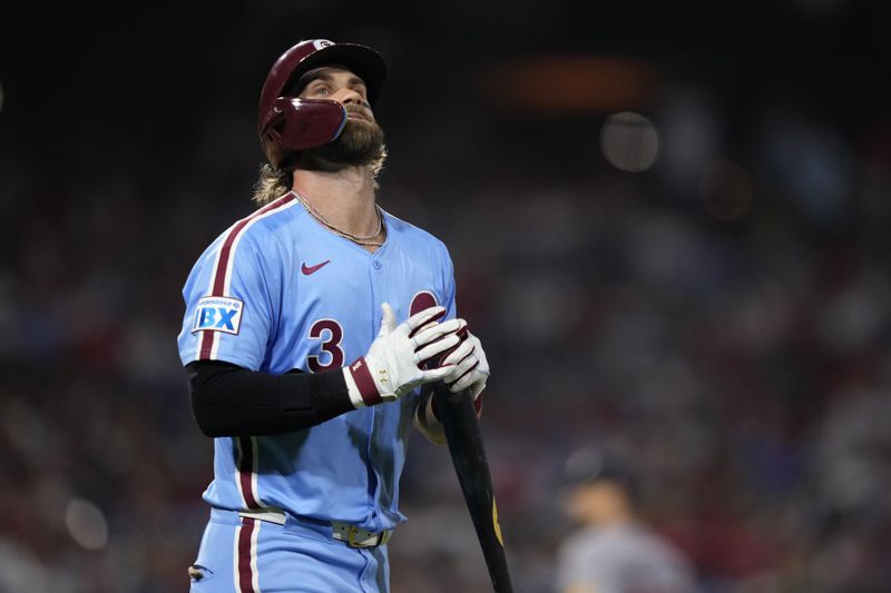 Philadelphia Phillies' Bryce Harper reacts after flying out against Atlanta Braves pitcher Charlie Morton during the fifth inning of a baseball game, Thursday, Aug. 29, 2024, in Philadelphia. (AP Photo/Matt Slocum)