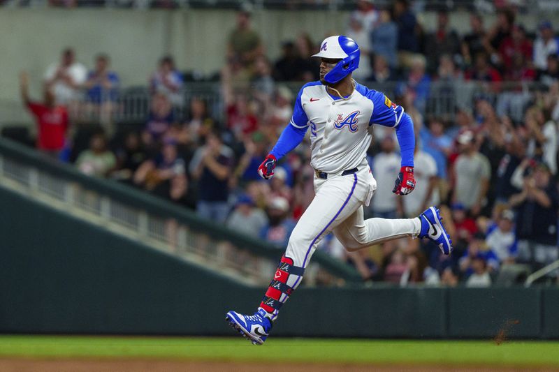 Atlanta Braves' Jorge Soler runs to second base after hitting a double in the third inning of a baseball game against the Los Angeles Dodgers, Saturday, Sept. 14, 2024, in Atlanta. (AP Photo/Jason Allen)